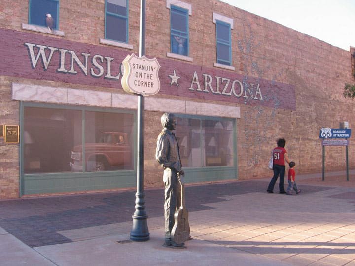 Statue in Winslow, Arizona made famous by the Eagles. There is a flatbed Ford and a lifesize statue of Jackson Browne at this famous corner in Winslow. Shady Hartshorne photo.