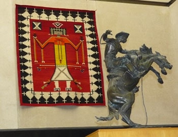 A statue by Frederic Remington and a Navajo blanket at the Stark Museum of Art in Orange, Texas