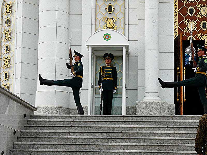 Turkmenistan: Tinhorn Tyranny 4 Guards goosestep at the mausoleum of the late President Saparmurat Niyozov in Ashgabat, Turkmenistan