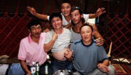 Merry local Kazak men with the author. Notice that the man on the far left appears to have passed out!