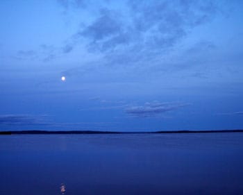 The moon rising over Steamboat Bay on Leech Lake