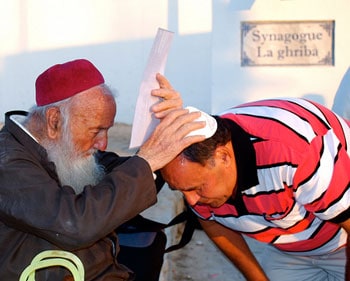 Receiving a blessing at the El Ghriba Festival on the island of Djerba in Tunisia