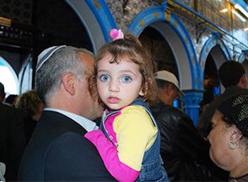 A little girlg at her first El Ghriba Festival 