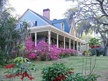 Spanish Moss and Southern Hospitality in St. Francisville 9 Spanish moss and blooming shrubs soften and hush the front porch of the Butler Greenwood plantation home. Photo by Henry Cancienne.