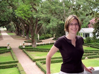 Spanish Moss and Southern Hospitality in St. Francisville 7 The author poses on the second-story porch of the Rosedown Plantation home with the front gardens in the background.