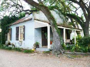 Spanish Moss and Southern Hospitality in St. Francisville 10 In the 1800s, when most of St. Francisville's plantations were built, kitchens were deemed too dangerous to house inside the main home. This old kitchen is still standing on the grounds of the Butler Greenwood Plantation. Today it is a B&B cottage. Photo by Henry Cancienne.