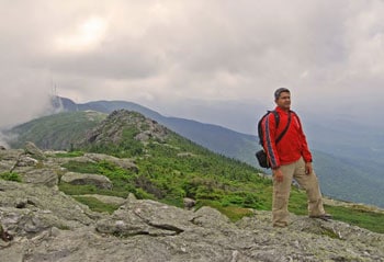 Hiking Mount Mansfield, Vermont's Highest Peak 8 Pinaki on the Long Trail of Mount Mansfield. He finally takes a break from clicking photographs to enjoy the scenery. A candid shot by Esha Samajpati.