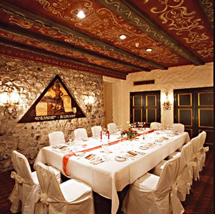 Private room at the Hotel Wilden Mann, with a painting of the Wild Man on the wall