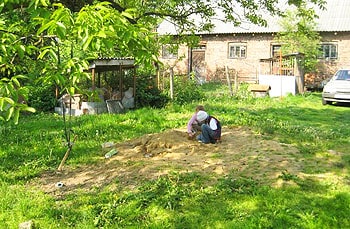 Ukraine through Shadows of History. Page Two 7 Children of distant relatives play on the property my mother's family fled during WWII.