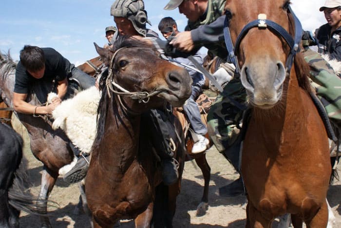Dead Goat Polo, National Sport of Kyrgyzstan 1 A rider seizes the carcass of a goat in a Dead Goat Polo match in Ashu, Kyrgyzstan. Photo by Sophie Ibbotson.