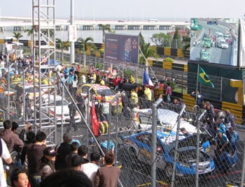 The Macau Grand Prix: Fearsome Motorsports Competition 8 Drivers wait on the grid for an accident to be cleared.