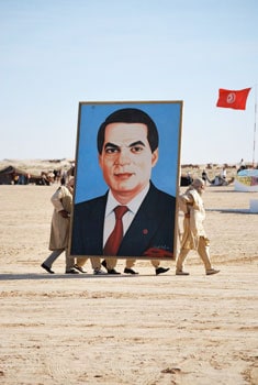 The Festival of the Sahara in Tunisia 3 The crowd chants their President's name as a larger-than-life photo of him is carried in.