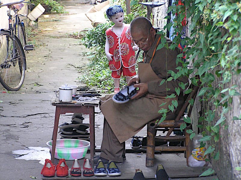 The Water Town of Wuzhen: The Venice of China 2 A traditional shoemaker at work in Wuzhen, China