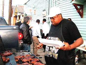 Bingo tends the grill outside the Bullets Sports Bar in New Orleans. Photos by Ann Banks.