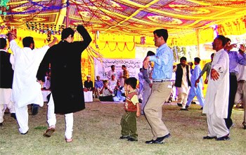 Men dance at the mass wedding in Northern Pakistan. photos by Heather Carreira