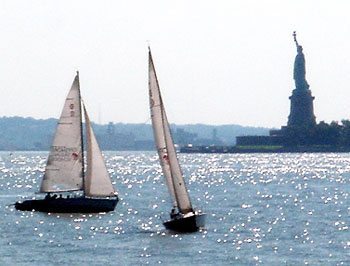 Sailboats and the Statue of Liberty in New York Harbor.