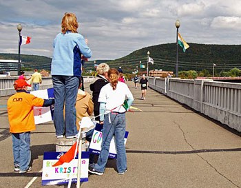 The Wineglass Marathon 2009 in full swing on the Pedestrian Bridge stretching across the Chemung River of New York.