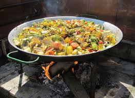 Valencia, Spain: Las Fallas, One Crazy Festival! 12 Paella cooks over an open flame at La Matandeta Restaurant.