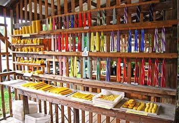 Beeswax candles on display at the market.