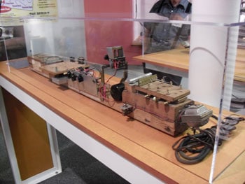 An exhibit dedicated to music legend, Les Paul, displays the first ever electric guitar-- a block of wood covered with wires and metal knobs!