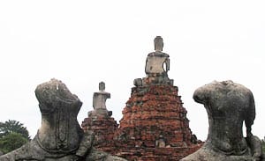 Buddha statues in various states of disrepair at Wat Phra Mahathat
