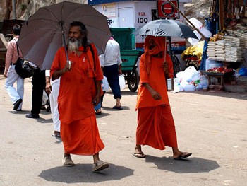 Sadhus use parasols to keep out of the sun.
