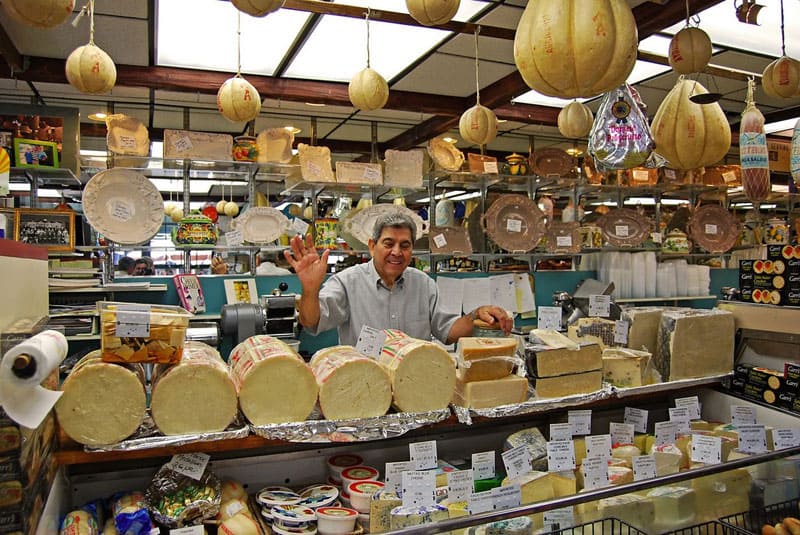 Tony with his collection of cheese at Tony's Colonial Food Store on Federal Hill in Providence, Rhode Island