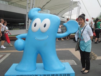 My guide, Vivi, poses with the original Haibao figure.