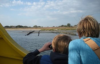 Mother and son use their binoculars looking out onto Jamaica Bay's Wildlife Refuge