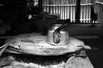 Mystic Tourism: Searching for the Yagé, in Peru 8 Stove, kettle and chicken in open plan local's hut