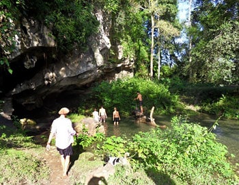 Locals and travelers swim in the streams.
