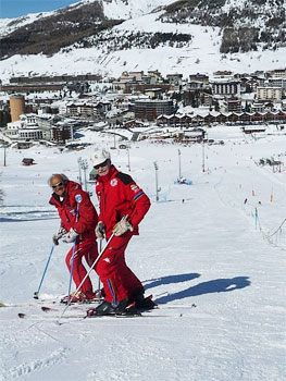 Riccardo the ski instructor on the mountain, with Sestriere in the background.