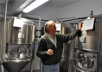 Brewmaster David Beardsell in his laboratory at the Noble Pig Brewhouse. Photo by Robin Schroffel.