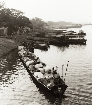 Long boats like this is how supplies are sent up river in a land where there are no roads to speak of. 