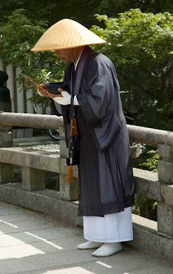 Kyoto: Japan's Ancient Capital is a Treasure of Temples 1 A monk offers blessings to visitors, Toda-ji Temple, Nara, Japan