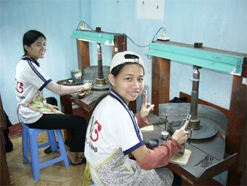 Disabled youth working on stoneware projects at the Nguyen Nga Center in Quy Nhon, Vietnam.