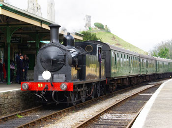 The Steam Train arrives in Corfe Castle. The train is manned by volunteers and railway enthusiast?s and takes passengers from Norden to Swanage in authentic carriages.
