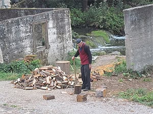 Croatia: The Roman's Favorite Summer Getaway 9 Chopping wood in Rastoke, Croatia.