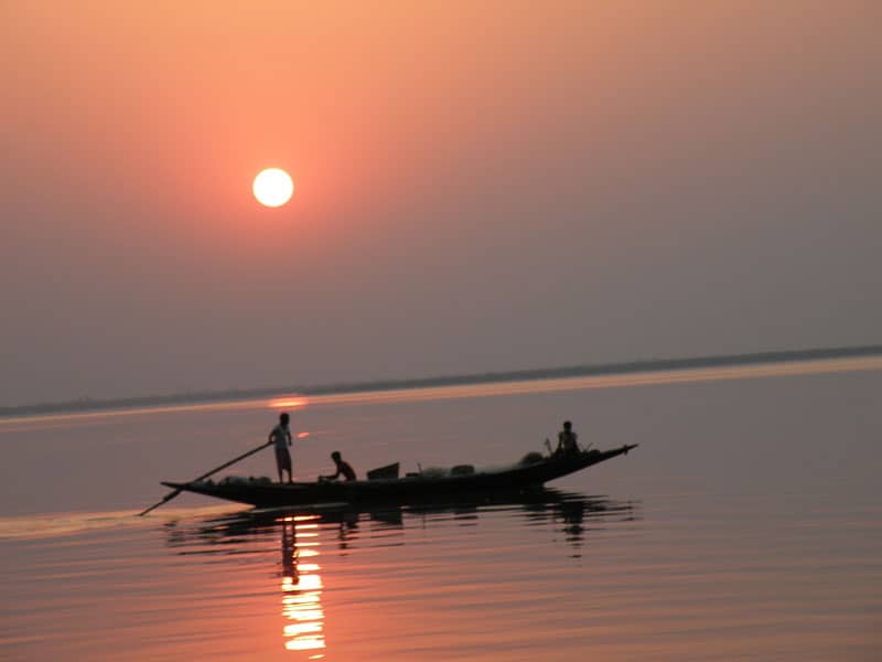A dinghy at sunset in the Sundarbans. Photo by Swati Dasgupta.