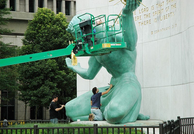 Cleaning Detroit's iconic statue, center of the city.