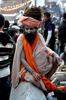 Sadhu dressed as Lord Shiva. His long hair is thought to be the home of the Ganges River.