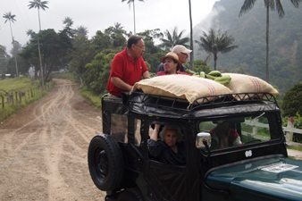 Riding on the back bumper of old Willy's Jeeps in the Coffee Triangle. Paul Shoul photo.