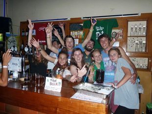 Volunteer bar tenders at Adventure Brew Hostel in La Paz, Bolivia.