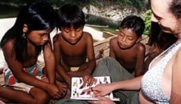 Marisol showing Embera children a book about birds. jon kohl photo