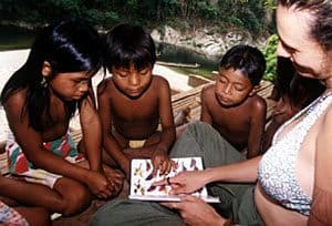 Marisol showing Embera children a book about birds. jon kohl photo