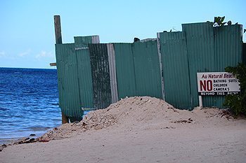 Jamaica's Nude Beaches 3 The big green fence at the nude beach in Montego Bay, Jamaica.