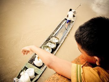 By cargo ship, to the Amazon 4 Fish for sale alongside the cargo ship.