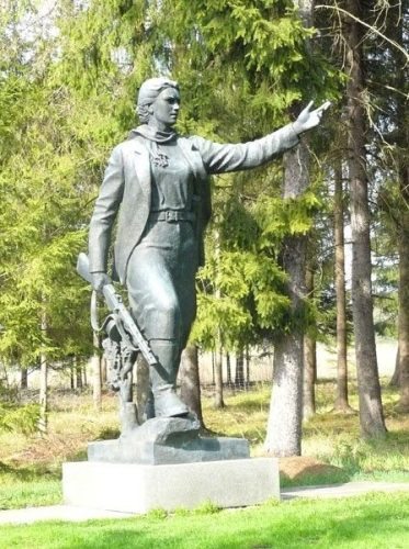 This is a statue dedicated to Maryt? Melnikait?, a partisan tortured and killed by the Nazis. The Soviets later needed a Lithuanian hero, so they gave her a Lithuanian name.