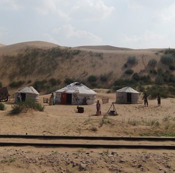 Yurts next to the railroad tracks at the desert resort.