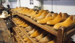 Shoe lasts on display with textile manufacturing machinery at the L-A Museum, Lewiston.